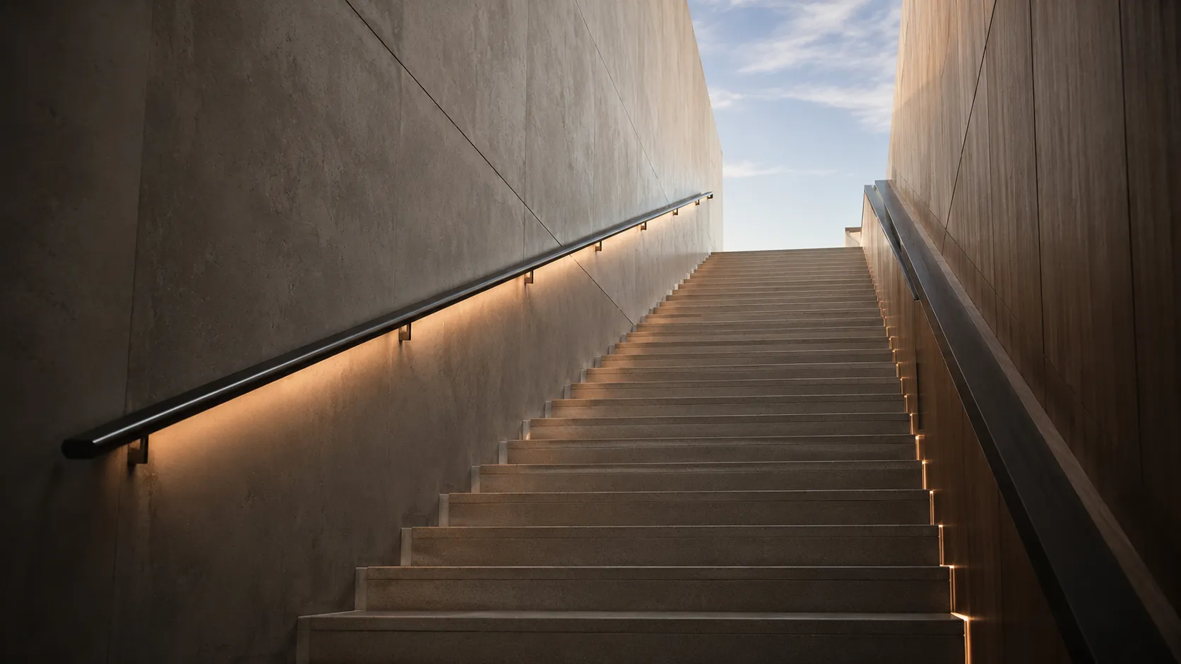 Modern architectural staircase ascending toward sky