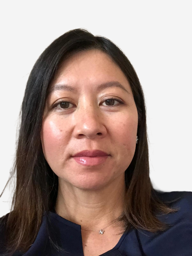 Jennifer Tran, Altum Vista's Advisor, in a navy blue top and pendant necklace, against a white background.